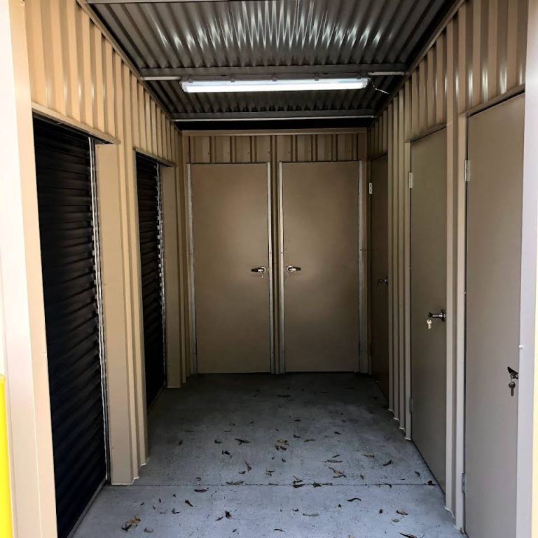 Indoor storage facility hallway with unit doors at Mount Cotton